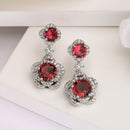 Rhodium Plated with Dual Red American Diamonds Drop Earrings