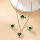 Rhodium Plated Silver Toned Heart Shaped Emerald Green American Diamond Studded Pendant Combo With Ring
