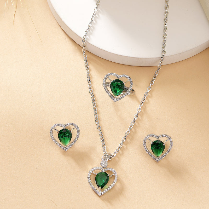 Rhodium Plated Silver Toned Heart Shaped Emerald Green American Diamond Studded Pendant Combo With Ring