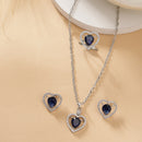 Rhodium Plated Silver Toned Heart Shaped Royal Blue American Diamond Studded Pendant Combo With Ring