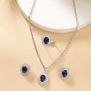 Rhodium Plated Silver Toned Oval Shaped Violet American Diamond Studded Pendant Combo With Ring