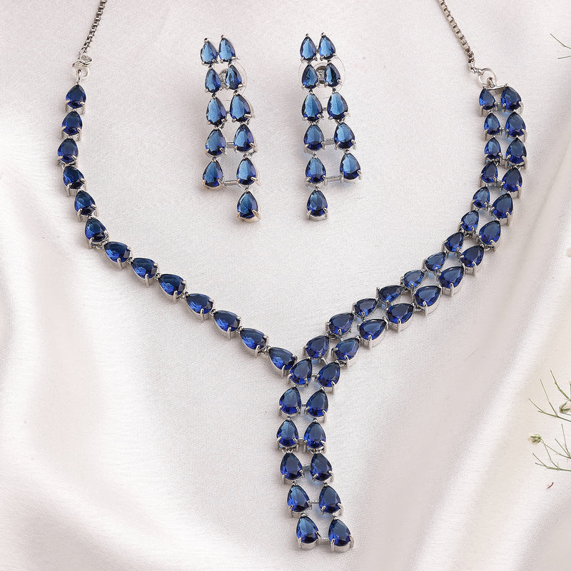 Rhodium Plated Silver Toned Teardrop Shaped Blue American Diamond Studded Jewellery Set