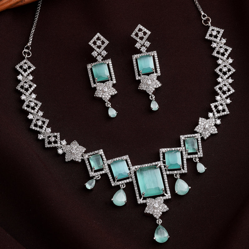 Rhodium Plated Silver Toned Rectangular Shaped Sea Green & White American Diamond Studded Jewellery Set
