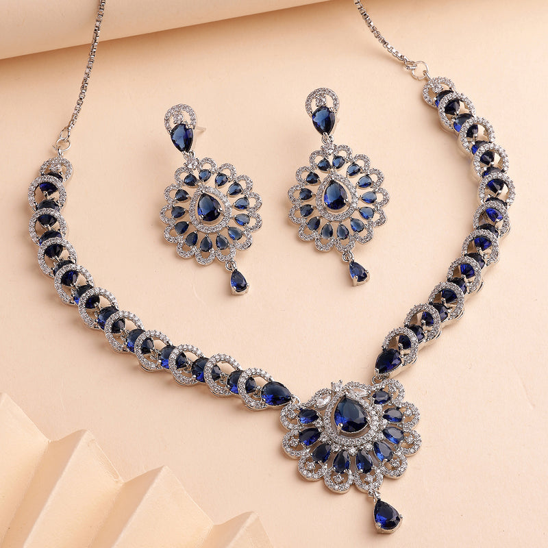 Rhodium Plated Silver Toned Ornate Shaped Navy Blue & White American Diamond Studded Jewellery Set