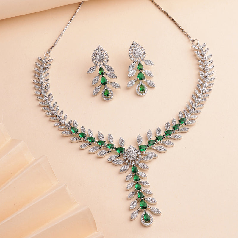 Rhodium Plated Silver Toned Leaf Shaped Green & White American Diamond Studded Necklace With Earrings Jewellery Set