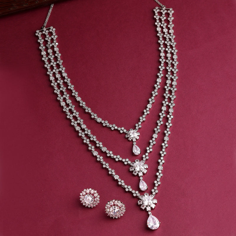 Rhodium Plated Silver Toned White American Diamond Studded Multi Layered Necklace With Earrings Jewellery Set