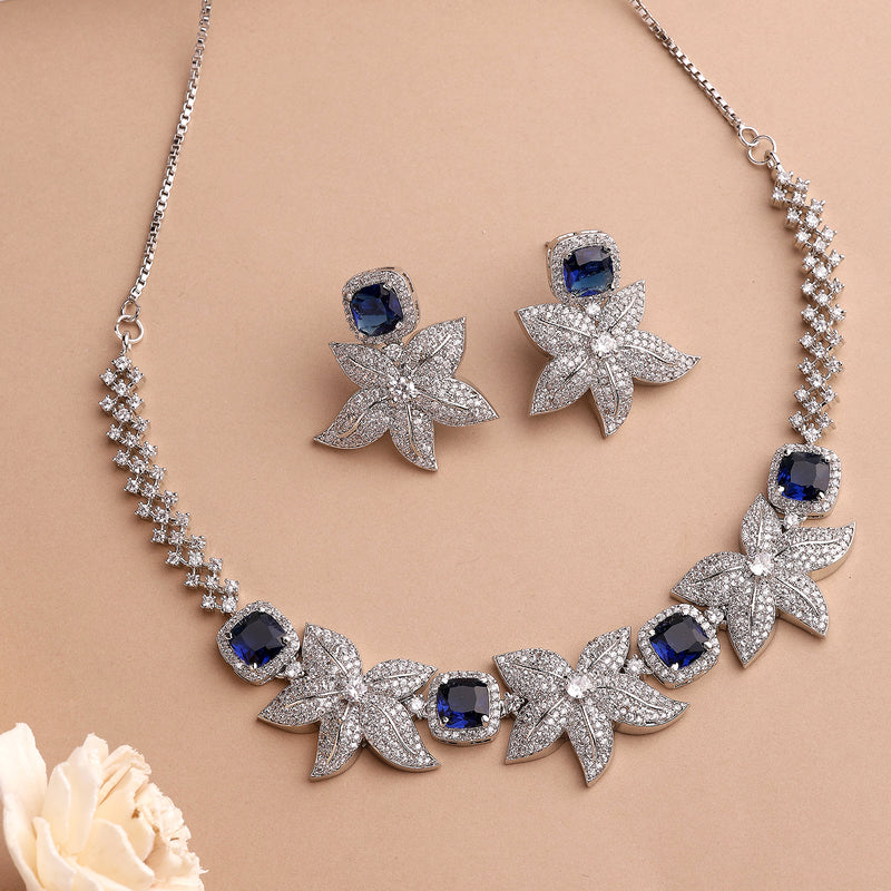 Rhodium Plated Silver Toned Floral Shaped Blue & White American Diamond Studded Jewellery Set