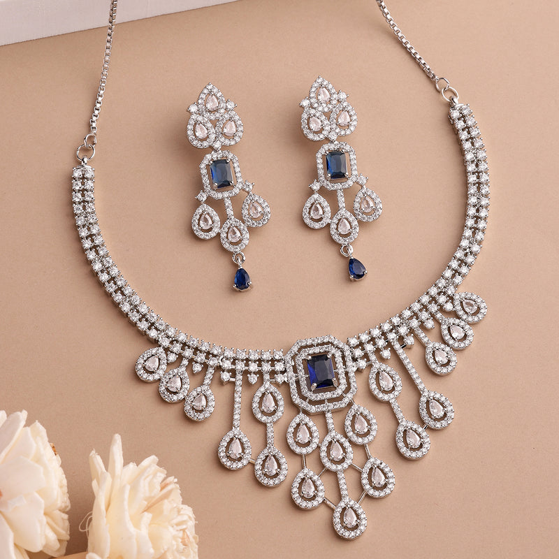 Rhodium Plated Silver Toned Teardrop Shaped Blue & White American Diamond Studded Jewellery Set