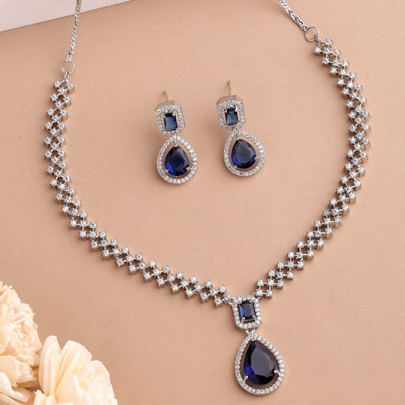 Rhodium Plated Silver Toned Teardrop Shaped Blue & White American Diamond Studded Jewellery Set