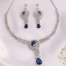 Rhodium Plated Silver Toned Floral Teardrop Shaped Navy Blue & White American Diamond Studded Jewellery Set