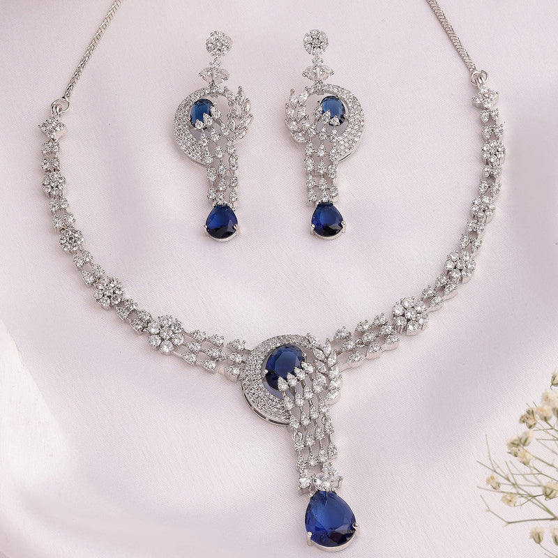 Rhodium Plated Silver Toned Floral Teardrop Shaped Navy Blue & White American Diamond Studded Jewellery Set