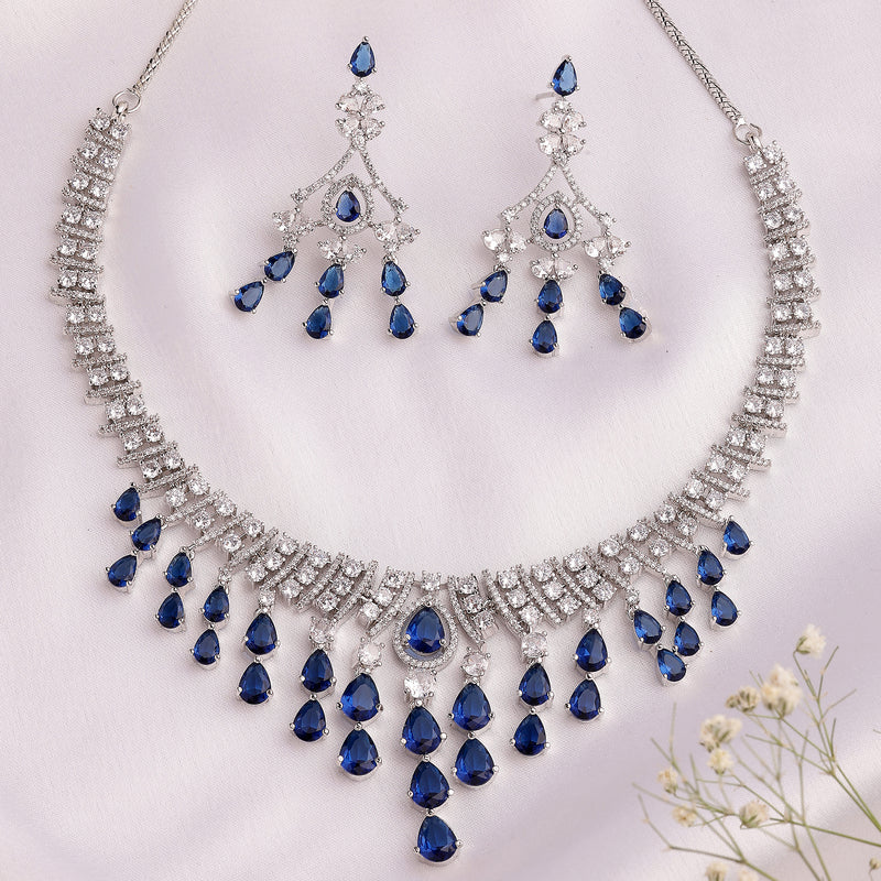 Rhodium Plated Silver Toned Teardrop Shaped Blue & White American Diamond Studded Jewellery Set