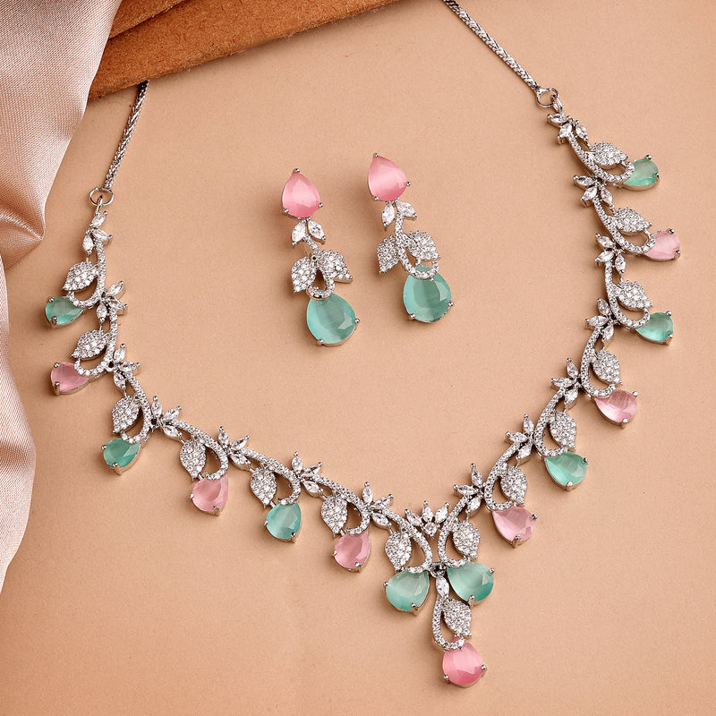 Rhodium Plated Silver Toned Leaf Teardrop Shaped Pink & Sea Green American Diamond Studded Jewellery Set