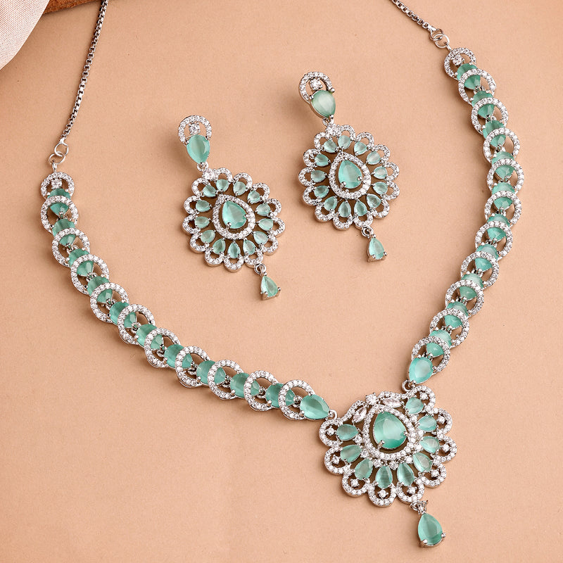 Rhodium Plated Silver Toned Ornate Shaped Sea Green & White American Diamond Studded Jewellery Set