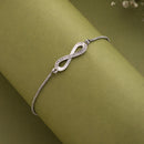 Rhodium Plated Silver Toned Infinity Shaped White Cubic Zirconia Studded Adjustable Bracelet