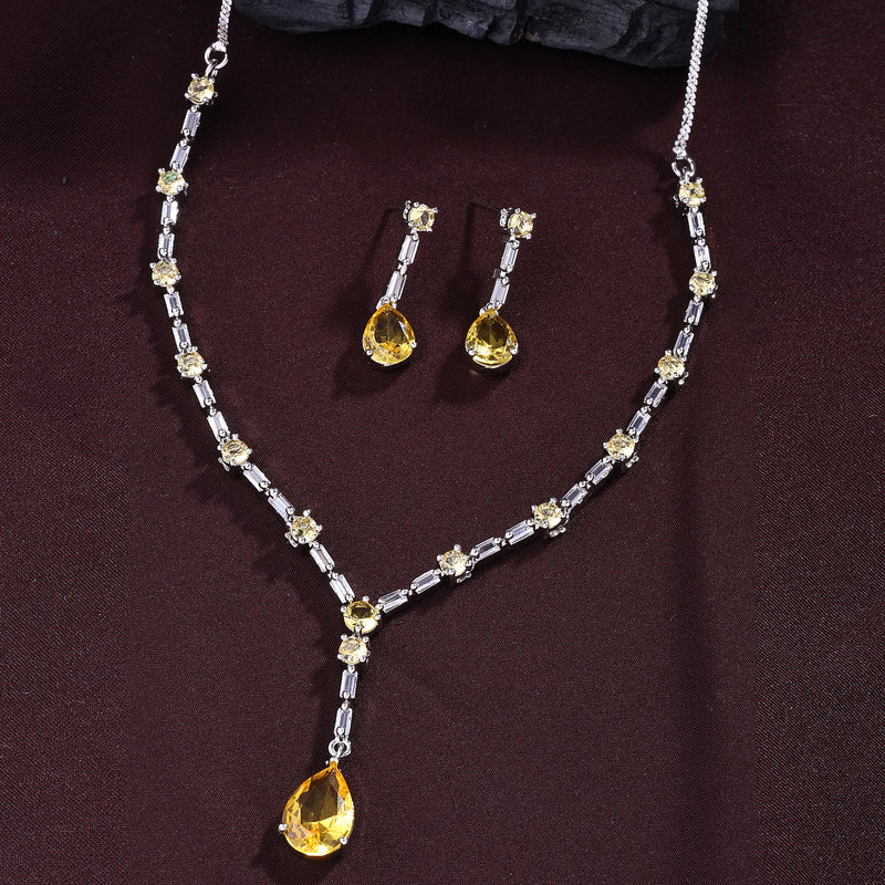 Rhodium Plated Silver Toned Teardrop Shaped Yellow & White American Diamond Studded Necklace With Earrings Jewellery Set