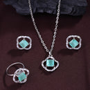 Rhodium Plated Silver Toned Square Shaped Sea Green & White American Diamond Studded Pendant Combo With Ring
