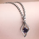 Rhodium Plated Silver Toned Purple American Diamond Studded Leaf Shaped Pendant With Chain