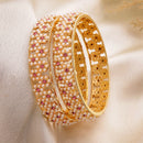 Gold Plated Floral Shaped White Pearl Studded Bangles Set Of 2
