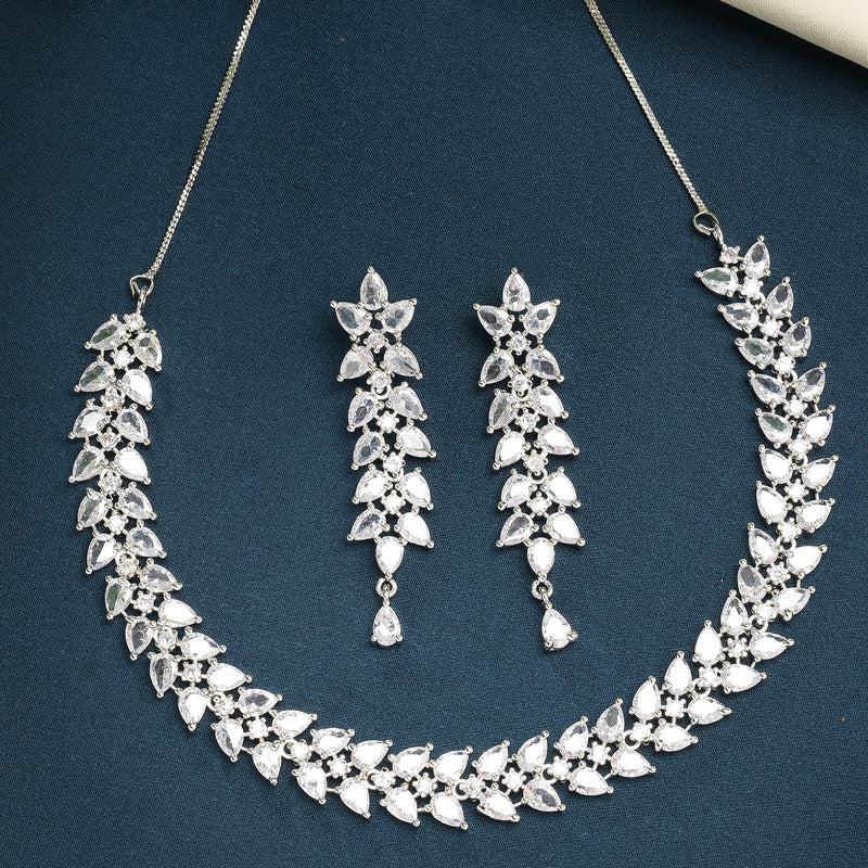 Rhodium Plated Silver Toned White Floral American Diamond Studded Necklace With Matching Earrings