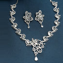 Rhodium Plated Silver Toned Floral Motif White AD Studded Necklace Set With Earrings