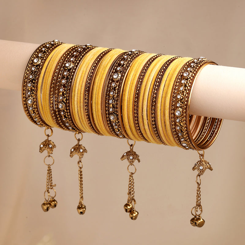 Gold-Plated Yellow Matte Finish Velvet Cz Studded Tasselled Bangles Set Of 56