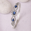 Rhodium Plated Silver Toned Oval & Teardrop Blue American Diamond Studded Cuff Bracelet