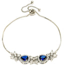 Rhodium Plated Silver Toned White Flower & Blue Teardrop American Diamond Studded Wraparound Adjustable Bracelet