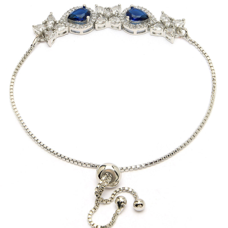 Rhodium Plated Silver Toned White Flower & Blue Teardrop American Diamond Studded Wraparound Adjustable Bracelet