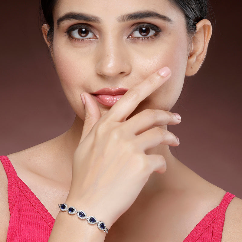 Rhodium Plated Silver Toned Teardrop Royal Blue American Diamond Studded Bracelet