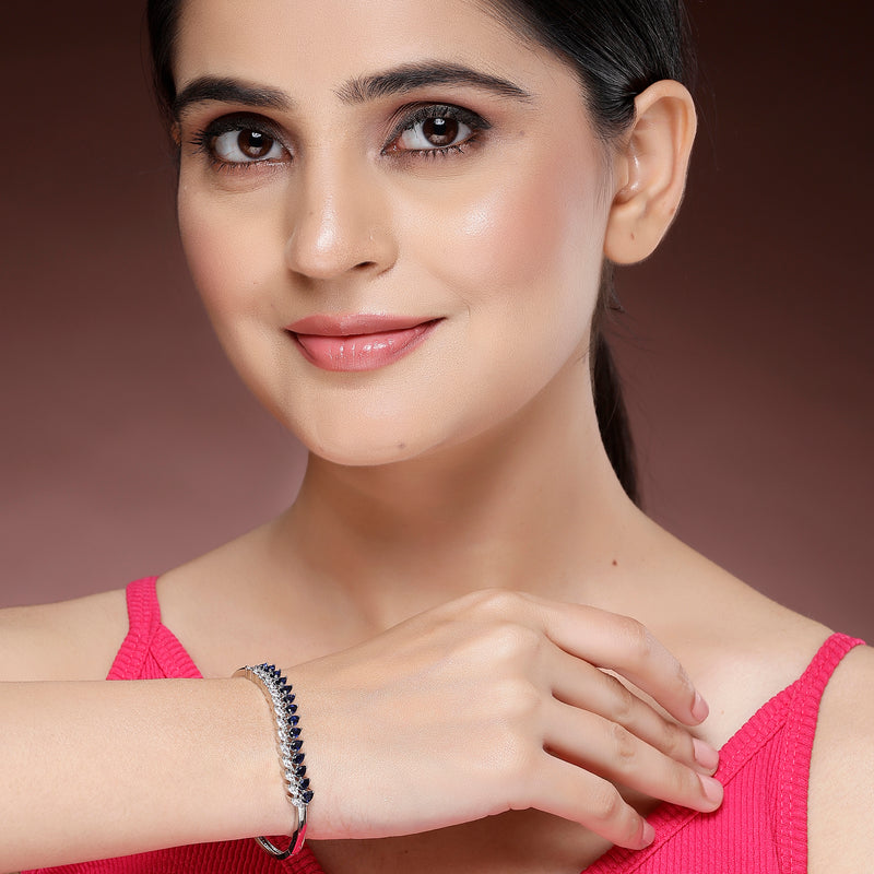 Rhodium Plated Silver Toned Leaf Shaped Royal Blue American Diamond Studded Bracelet