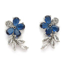 Rhodium Plated Silver Toned Floral Shaped Navy Blue & White American Diamond Studded Stud Earrings