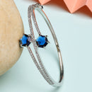 Rhodium Plated Silver Toned Round Shaped  Blue American Diamond Studded  Bracelet