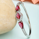 Rhodium Plated Silver Toned Teardrop Shaped Ruby Red American Diamond Studded Bracelet