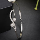 Rhodium Plated Silver Toned Twisted White American Diamond Studded Bracelet