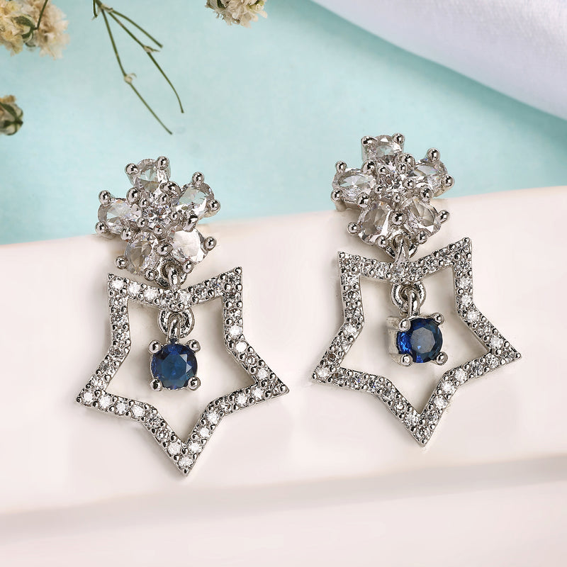 Rhodium Plated Silver Toned Starry Floral Shaped Navy Blue & White American Diamond Studded Drop Earrings