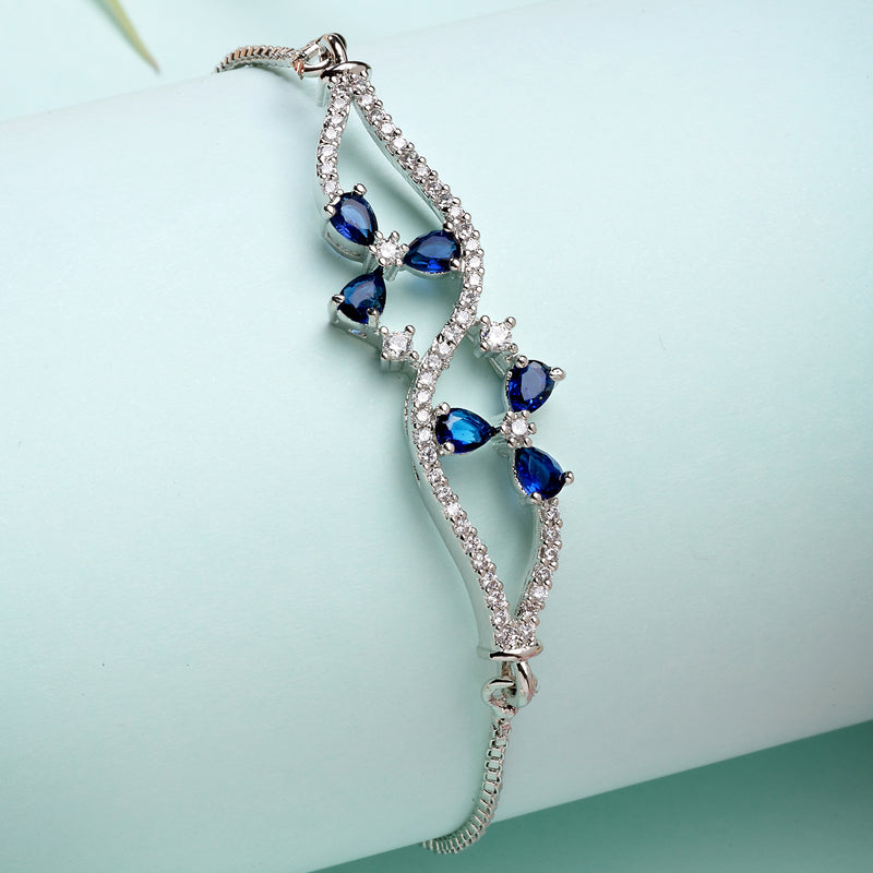 Rhodium Plated Silver Toned Floral Royal Blue American Diamond Studded Bracelet