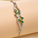Rhodium Plated Silver Toned Floral  Emerald Green American Diamond Studded Bracelet