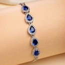 Rhodium Plated Silver Toned Teardrop Royal Blue American Diamond Studded Bracelet