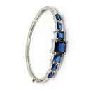 Rhodium Plated Silver Toned Square Shaped Blue American Diamond Studded Bracelet