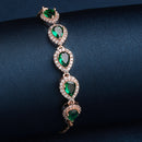 Rose Gold Plated Teardrop Shaped Emerald Green American Diamond Studded Bracelet