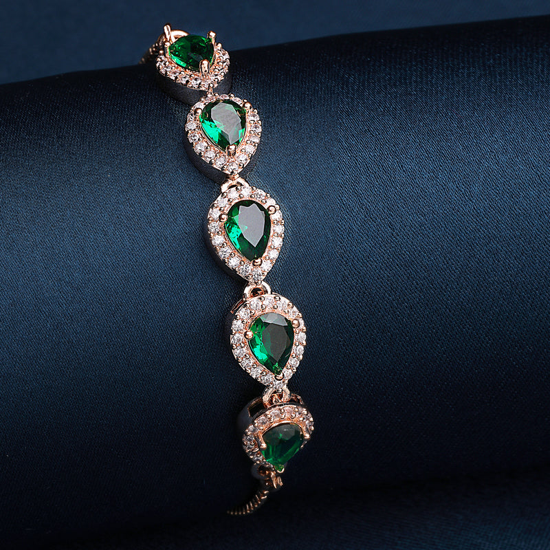 Rose Gold Plated Teardrop Shaped Emerald Green American Diamond Studded Bracelet
