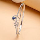 Rhodium Plated Silver Toned Blue Teardrop American Diamond Studded Cuff Bracelet