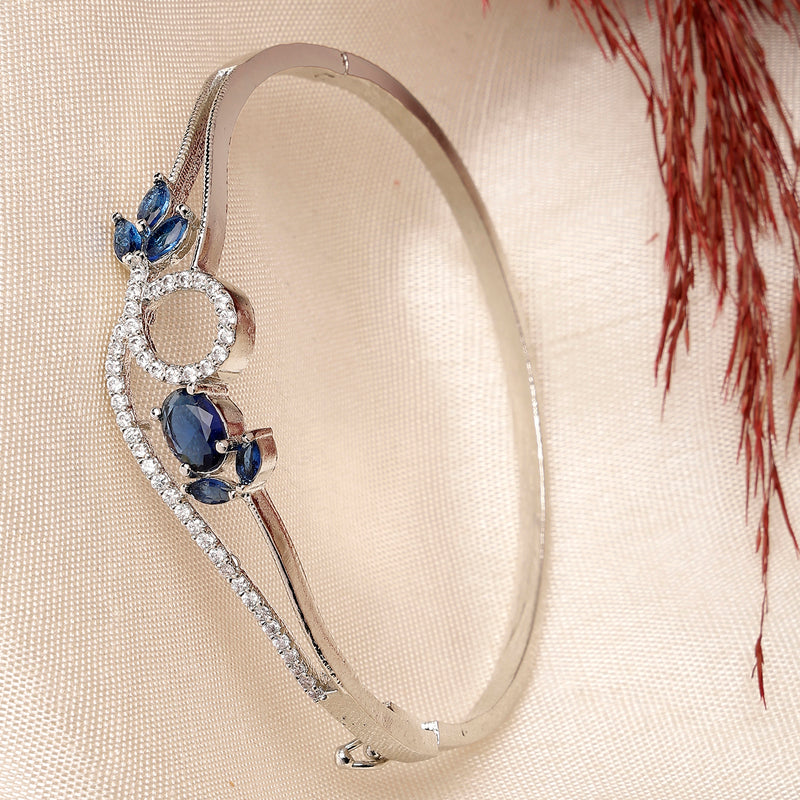 Rhodium Plated Silver Toned Nature Inspired Blue Oval American Diamond Studded Cuff Bracelet