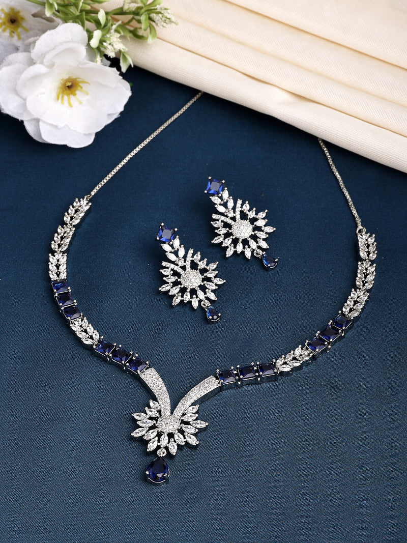 Rhodium Plated with Blue American Diamond Studded Floral Design & Curved Shaped Necklace Set