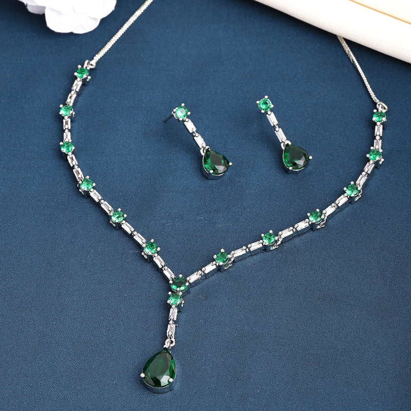 Rhodium Plated Silver Toned Teardrop Style Emerald Green American Diamond Studded Jewellery Set