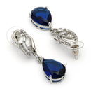 Rhodium Plated Silver Toned Teardrop Shaped Navy Blue & White American Diamond Studded Drop Earrings