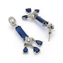 Rhodium Plated Silver Toned Bar Shaped Blue & White American Diamond Studded Earrings