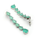 Rhodium Plated Silver Toned Teardrop Shaped Sea Green American Diamond Studded Linear Dangler Earrings