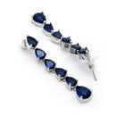 Rhodium Plated Silver Toned Teardrop Shaped Navy Blue American Diamond Studded Linear Dangler Earrings
